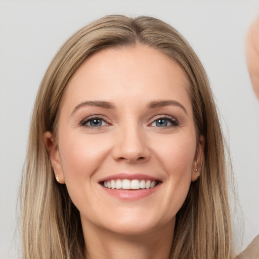 Joyful white young-adult female with long  brown hair and grey eyes