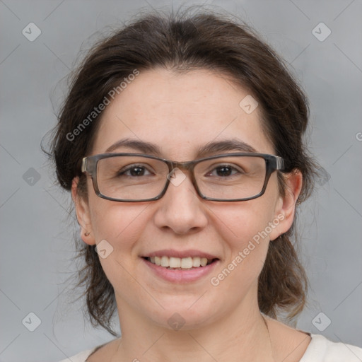 Joyful white adult female with medium  brown hair and brown eyes