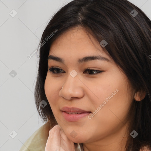 Joyful latino young-adult female with long  brown hair and brown eyes