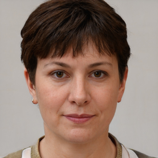 Joyful white adult female with short  brown hair and brown eyes