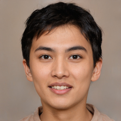 Joyful asian young-adult male with short  brown hair and brown eyes
