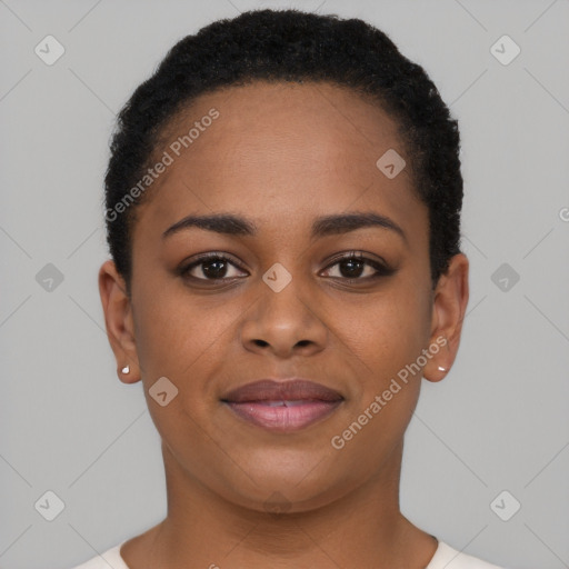 Joyful black young-adult female with short  black hair and brown eyes