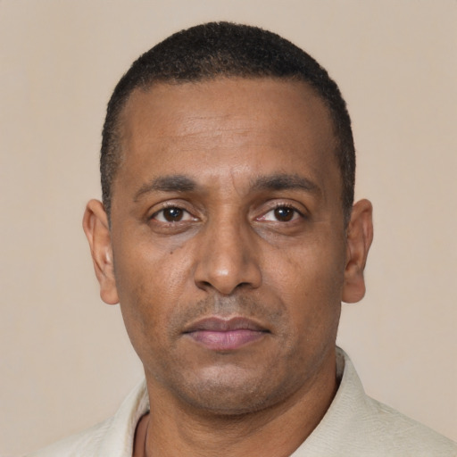 Neutral black adult male with short  black hair and brown eyes