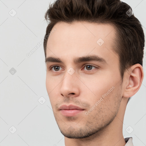 Neutral white young-adult male with short  brown hair and brown eyes