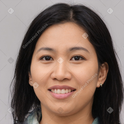 Joyful asian young-adult female with long  brown hair and brown eyes