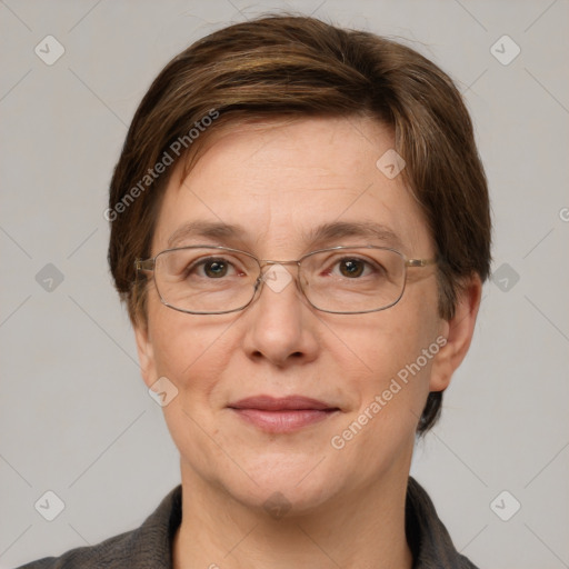 Joyful white adult female with short  brown hair and grey eyes