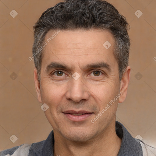 Joyful white adult male with short  black hair and brown eyes