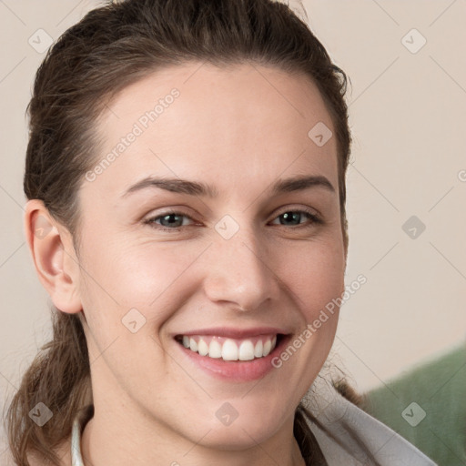 Joyful white young-adult female with long  brown hair and grey eyes