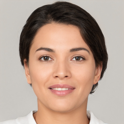 Joyful white young-adult female with medium  brown hair and brown eyes