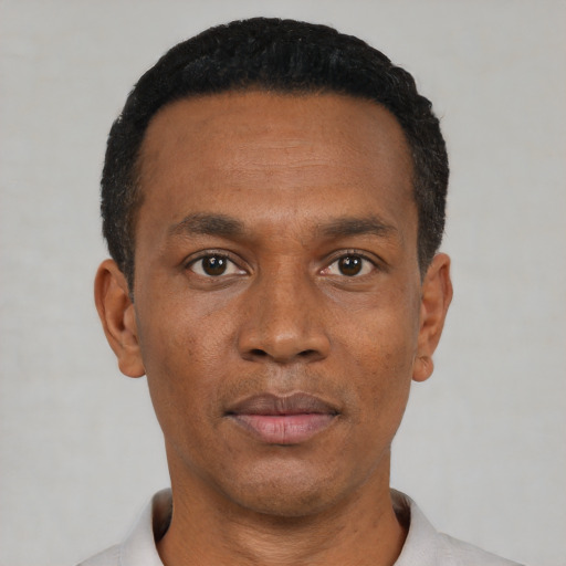 Neutral black adult male with short  black hair and brown eyes