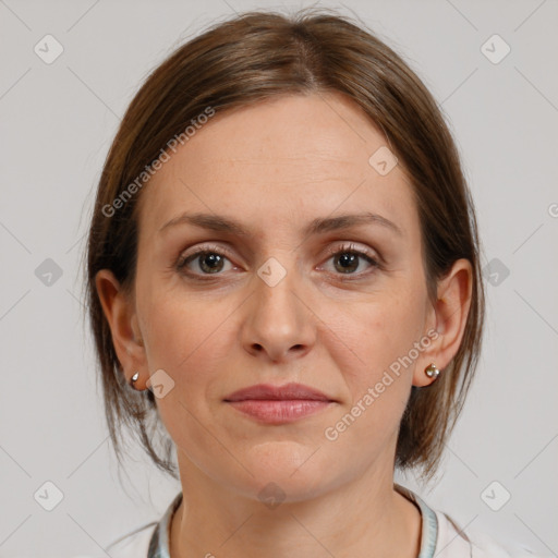 Joyful white adult female with medium  brown hair and brown eyes