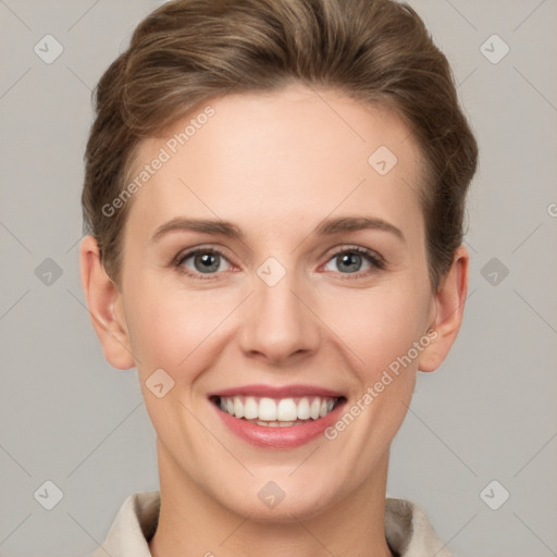 Joyful white young-adult female with short  brown hair and grey eyes