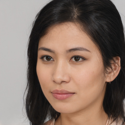 Neutral asian young-adult female with medium  brown hair and brown eyes