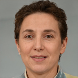 Joyful white adult female with short  brown hair and brown eyes