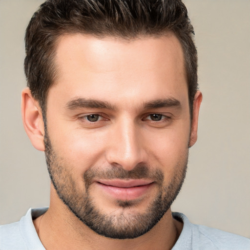 Joyful white young-adult male with short  brown hair and brown eyes