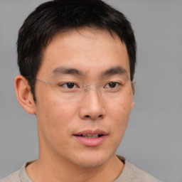 Neutral asian young-adult male with short  brown hair and brown eyes