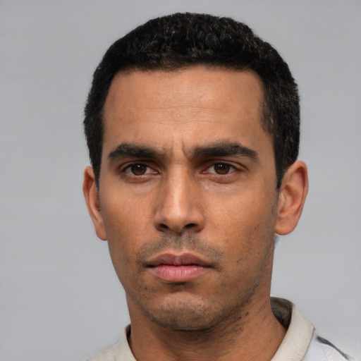 Neutral white young-adult male with short  black hair and brown eyes