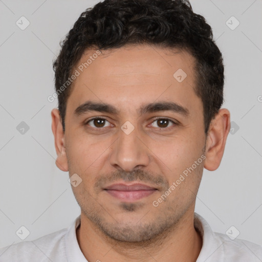 Joyful white young-adult male with short  black hair and brown eyes