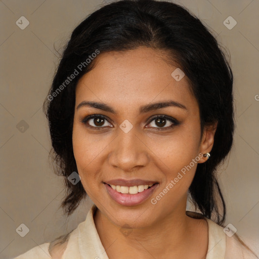 Joyful black young-adult female with medium  brown hair and brown eyes