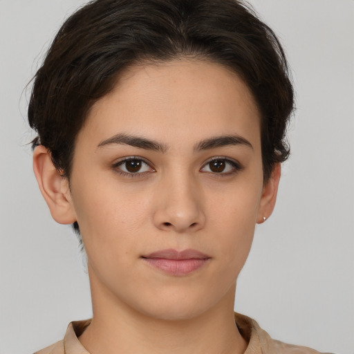 Neutral white young-adult female with short  brown hair and brown eyes