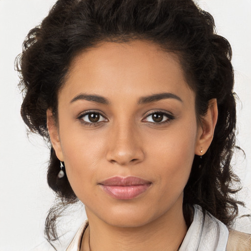 Joyful latino young-adult female with long  brown hair and brown eyes