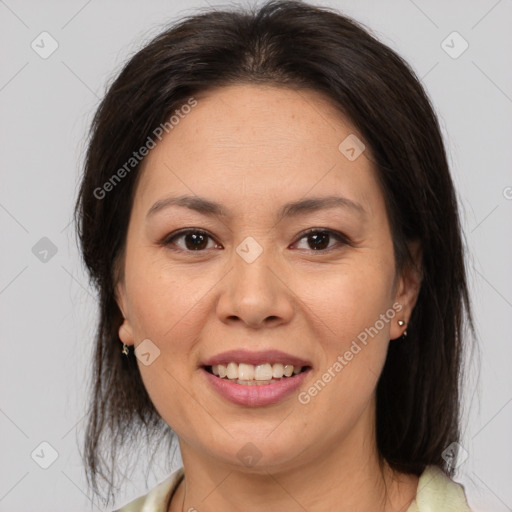 Joyful white adult female with medium  brown hair and brown eyes