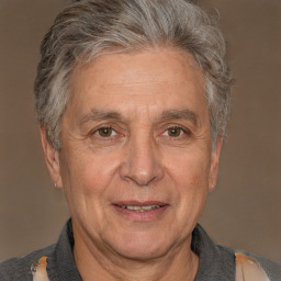 Joyful white middle-aged male with short  gray hair and brown eyes