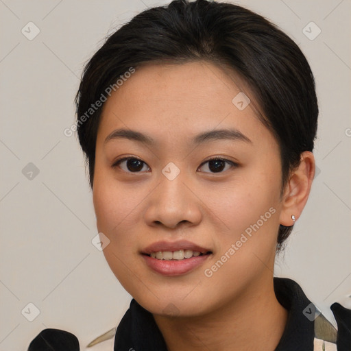 Joyful asian young-adult female with short  brown hair and brown eyes