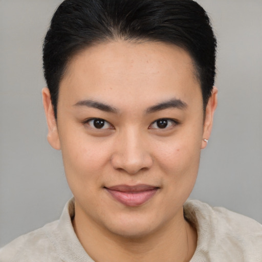 Joyful asian young-adult female with short  brown hair and brown eyes