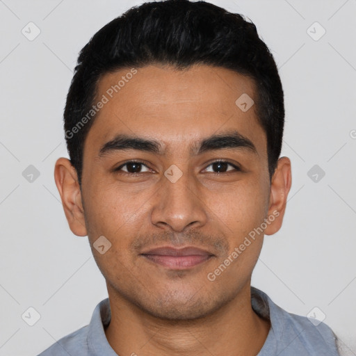 Joyful latino young-adult male with short  black hair and brown eyes