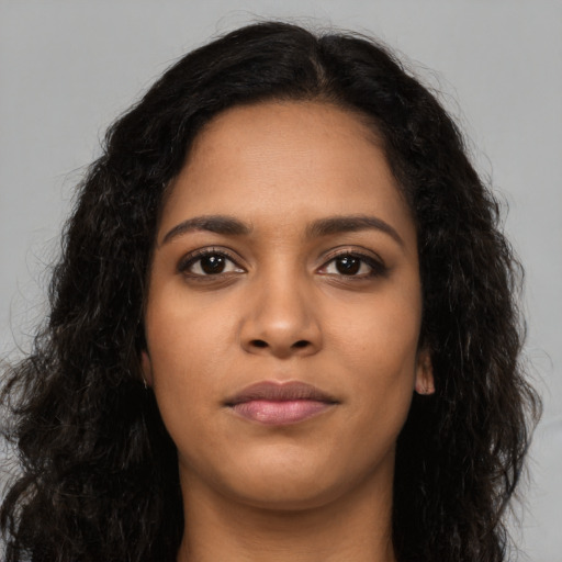 Neutral latino young-adult female with long  brown hair and brown eyes