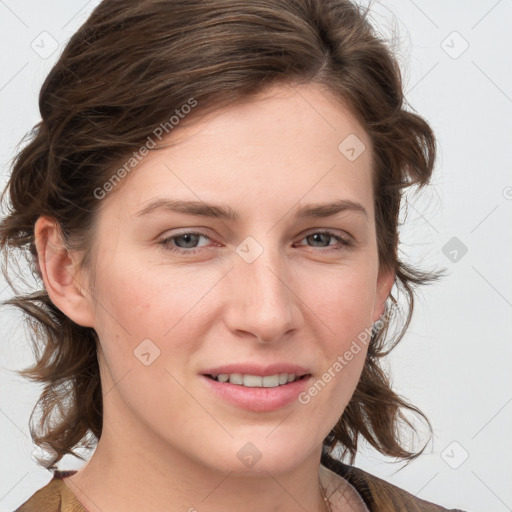 Joyful white young-adult female with medium  brown hair and blue eyes