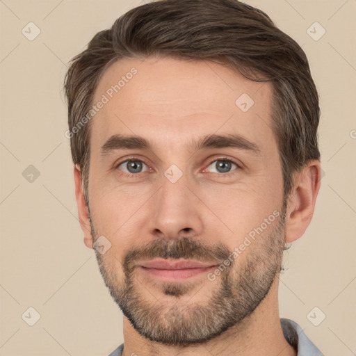 Joyful white adult male with short  brown hair and brown eyes