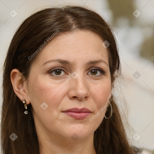 Joyful white adult female with long  brown hair and brown eyes