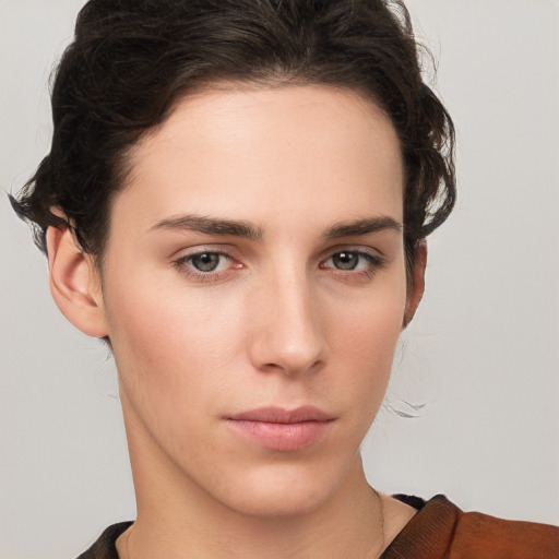 Neutral white young-adult female with short  brown hair and brown eyes