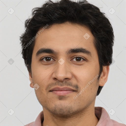 Joyful latino young-adult male with short  brown hair and brown eyes