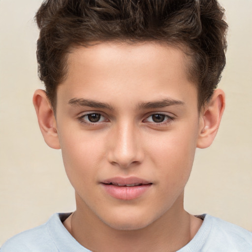 Joyful white child male with short  brown hair and brown eyes