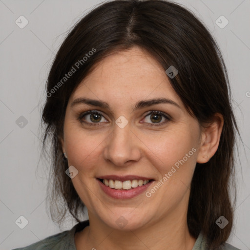 Joyful white adult female with medium  brown hair and brown eyes