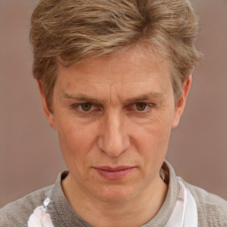 Joyful white middle-aged male with short  brown hair and brown eyes