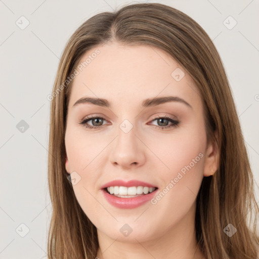 Joyful white young-adult female with long  brown hair and green eyes