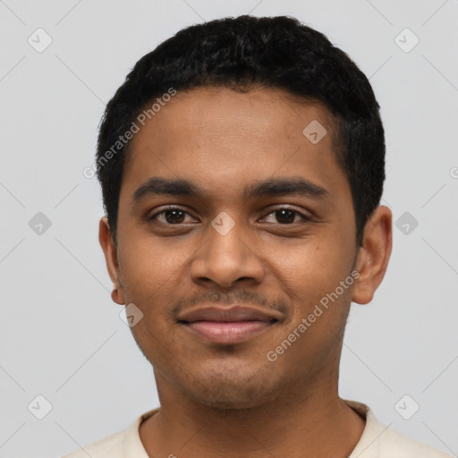 Joyful latino young-adult male with short  black hair and brown eyes