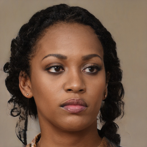 Neutral black young-adult female with long  brown hair and brown eyes