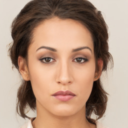 Neutral white young-adult female with medium  brown hair and brown eyes