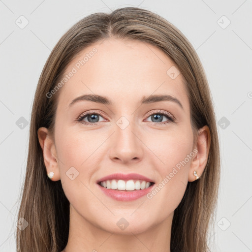 Joyful white young-adult female with long  brown hair and blue eyes