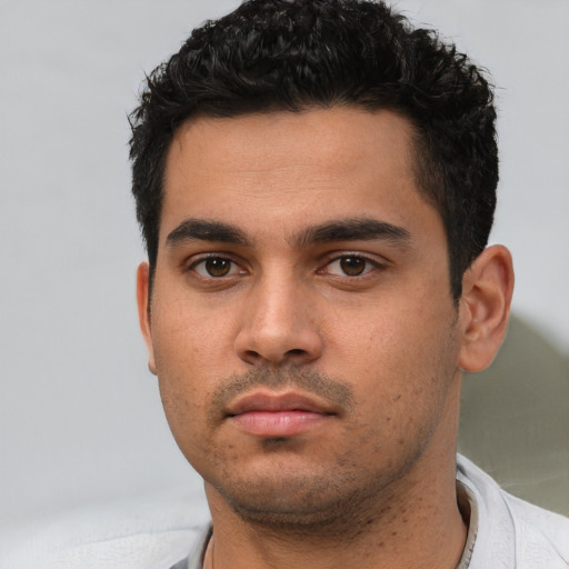 Neutral white young-adult male with short  black hair and brown eyes