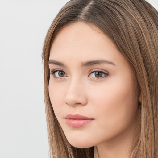 Neutral white young-adult female with long  brown hair and brown eyes