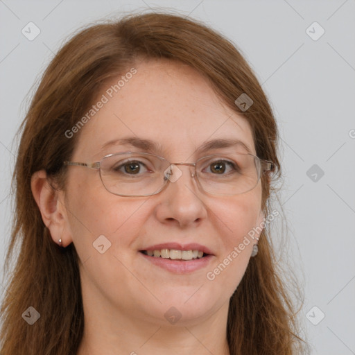 Joyful white adult female with long  brown hair and grey eyes