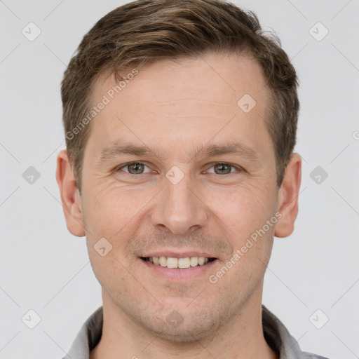 Joyful white adult male with short  brown hair and grey eyes