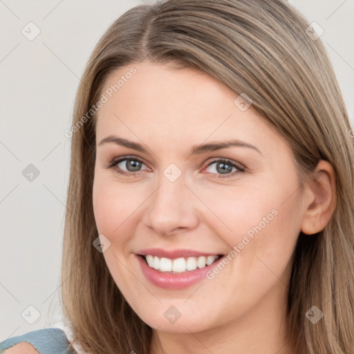 Joyful white young-adult female with long  brown hair and grey eyes