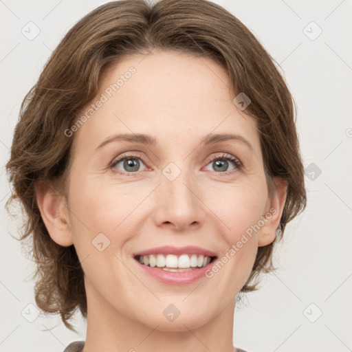 Joyful white adult female with medium  brown hair and green eyes